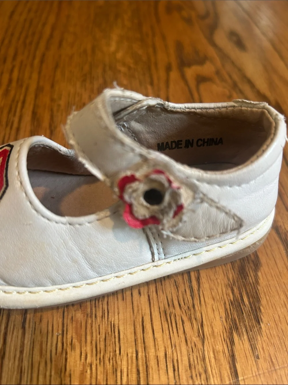 Team Squeaks Kids White Mary Jane Shoes with Red NC State Logo